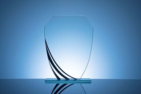 Elegant Blank Glass Shield Trophy On Dark Blue 2021 08 28 09 01 01 Utc